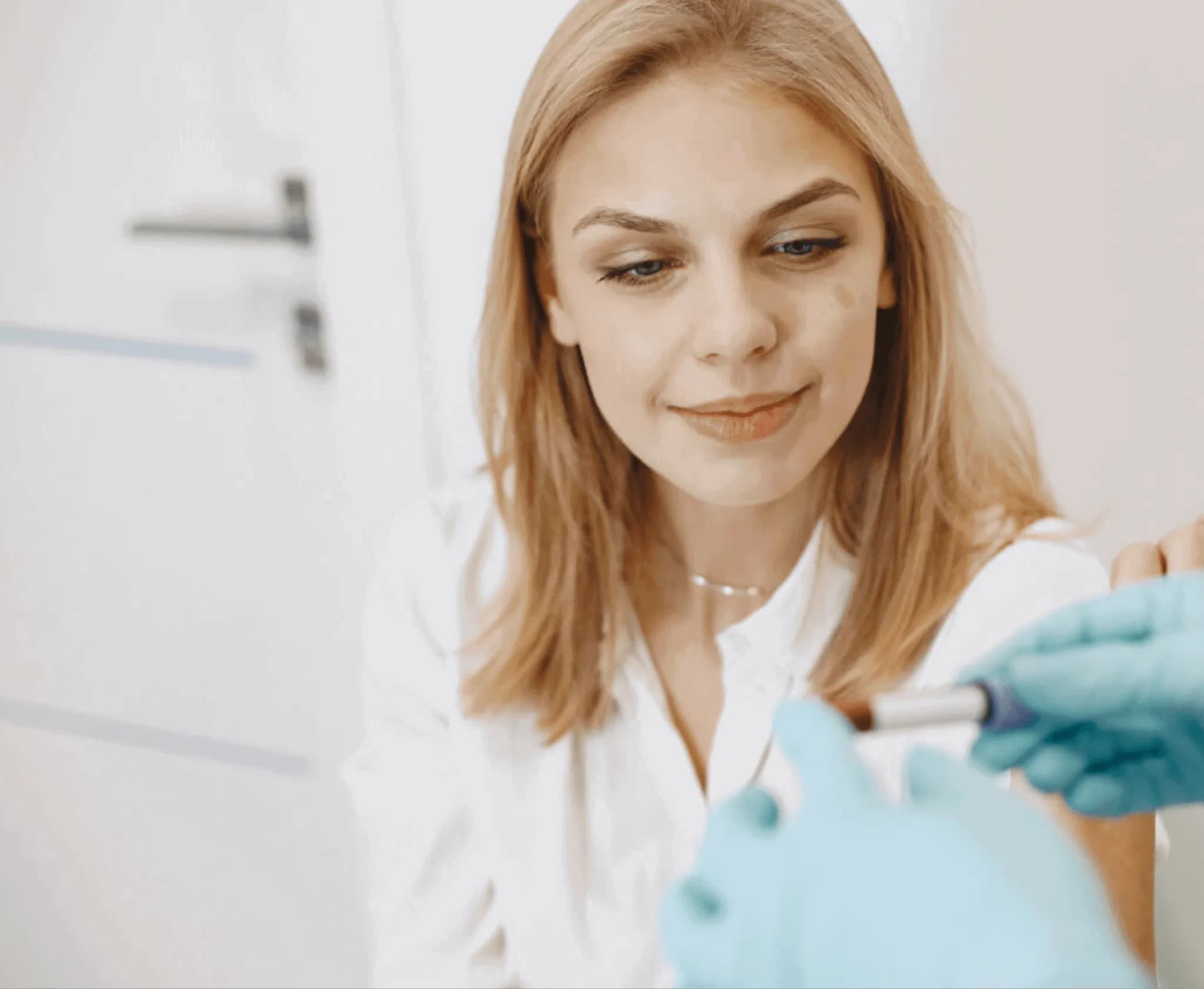 A woman having blood drawn at home by an Instalab phlebotomist